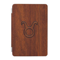 Taurus Zodiac Symbol on Mahogany Decor