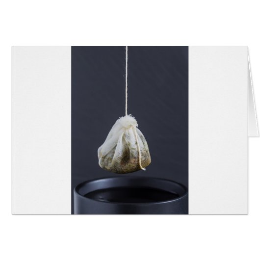 Tea bag is hung in a cup (Front Horizontal)