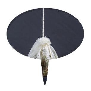 Tea bag is hung in a cup cake topper