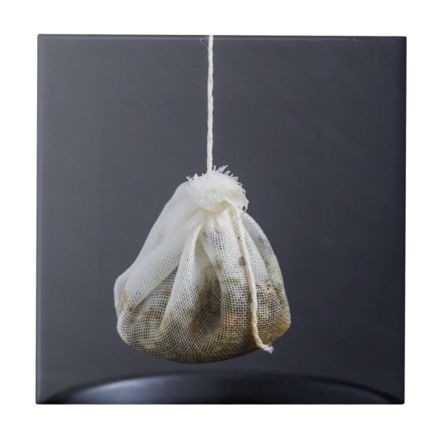Tea bag is hung in a cup ceramic tile (Front)