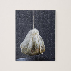 Tea bag is hung in a cup jigsaw puzzle