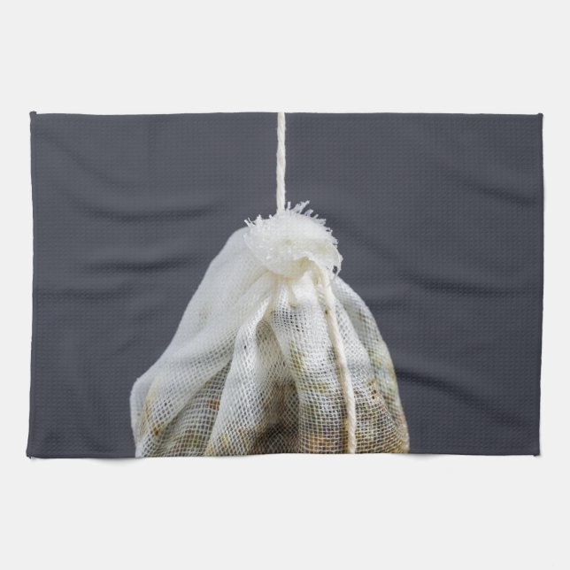 Tea bag is hung in a cup kitchen towel (Horizontal)
