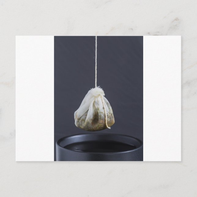 Tea bag is hung in a cup postcard (Front)