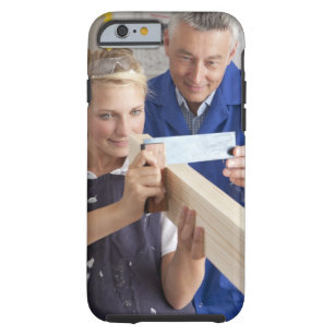 Teacher helping student measuring planed wood in tough iPhone 6 case