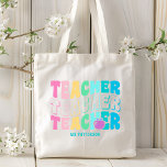 Teacher Modern Rainbow Colors Personalized Name Tote Bag<br><div class="desc">Teacher Modern Rainbow Colors Personalized Name Tote Bag features the text "Teacher" in modern rainbow color repeat script typography with your custom personalized name below. Perfect for your favorite teacher for teacher appreciation,  birthday,  Christmas,  holidays and more. Designed by Evco Studio www.zazzle.com/store/evcostudio</div>