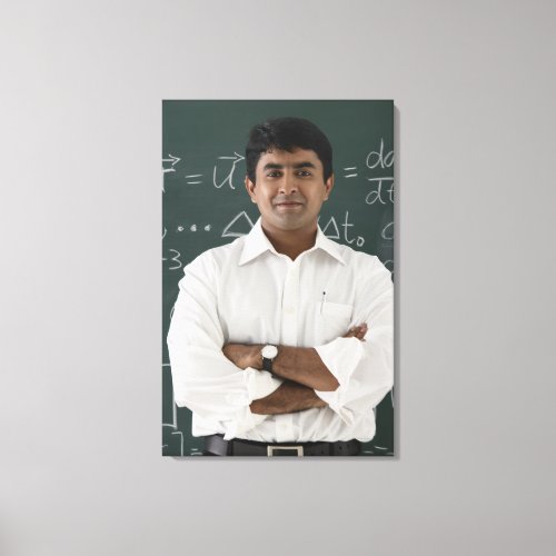 teacher standing in front of chalkboard arms canvas print
