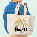 Teacher Teach Love Inspire Rainbow Personalized Large Tote Bag<br><div class="desc">Teacher Teach Love Inspire Rainbow Personalized Name Tote Bag features a pencil as part of a rainbow with a love heart with the text "Teacher Teach Love Inspire" in modern script typography with your custom personalized name. Perfect for your favorite teacher for teacher appreciation, birthday, Christmas, holidays and more. Designed...</div>