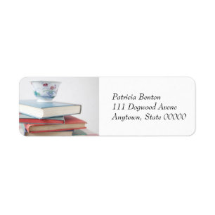 Teacup on book stack address label