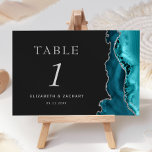 Teal Blue Agate Silver Dark Wedding Table Number<br><div class="desc">The right-hand edge of this elegant modern wedding table number card features a teal blue watercolor agate border trimmed with faux silver glitter. The customizable text combines silver gray Roman serif,  italic and copperplate fonts on an off-black background.</div>