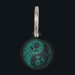 Teal Blue and Black Yin Yang Roses Pet ID Tag<br><div class="desc">This beautiful yin yang design features two stylized tribal roses. Intricate swirls and lines decorate both sides of this traditional symbol creating a delicate pattern. The two flowers flow from the bottom of the teardrop on either side with leaves growing from the stems. This unique floral pattern is a striking...</div>