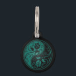 Teal Blue and Black Yin Yang Roses Pet ID Tag<br><div class="desc">This beautiful yin yang design features two stylized tribal roses. Intricate swirls and lines decorate both sides of this traditional symbol creating a delicate pattern. The two flowers flow from the bottom of the teardrop on either side with leaves growing from the stems. This unique floral pattern is a striking...</div>
