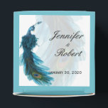 Teal Blue Peacock Plume Wedding Favor Box<br><div class="desc">This beautiful and elegant design, called Teal Blue Peacock Plume Wedding, has a bright white background with a teal border. In the background is a pale peacock tail feather with a full peacock illustration in the lower right corner. This would be perfect for your wedding or event! This set has...</div>
