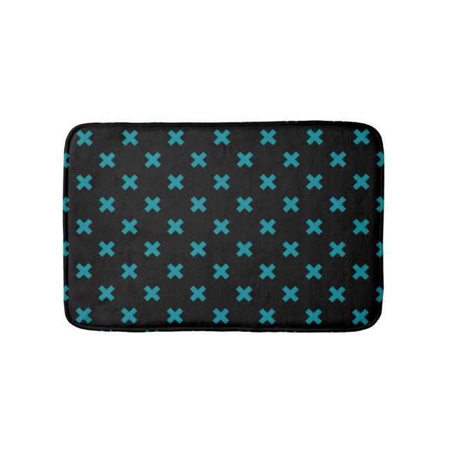 Teal cross stitches on black bath mat (Front)