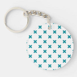 Teal cross stitches on white keychain