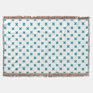 Teal cross stitches on white throw blanket