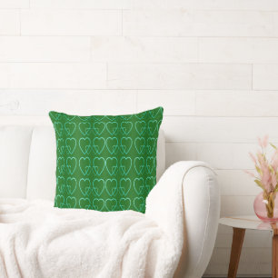 Teal hearts on green throw pillow