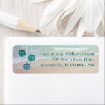 Teal Ocean Tropical Christmas Return Address Label<br><div class="desc">Return address labels with a tropical Christmas theme.  Ocean water and beach sand background image with hanging ball ornaments in pretty teal color.  Printed text is aligned to the right.  Print three or four name and address lines.  Remove the ornaments if needed.</div>