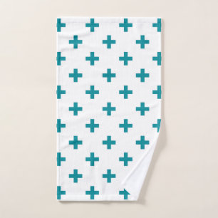 Teal polka crosses on white hand towel 