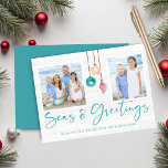 Teal Seas and Greetings Coastal Wood Holiday Photo Card<br><div class="desc">Teal Seas and Greetings Seashell Ornament on Coastal Wood Holiday Photo Christmas Cards featuring ocean teal blue and sandy tan shell ornaments hanging from sailing jute rope on coastal shiplap wood with elegant typography. Add two of your photos and a personal message for a fun nautical holiday card. Please contact...</div>