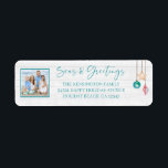 Teal Seas and Greetings Seashell Ornament Photo Label<br><div class="desc">Teal Seas and Greetings Seashell Ornament Photo featuring turquoise teal blue, tropical pink, and sandy tan shell ornaments hanging from sailing jute rope with elegant typography against a beachy white wood background. Add your photo and details for a fun nautical holiday card. The perfect coastal, beachy feel for your holiday...</div>