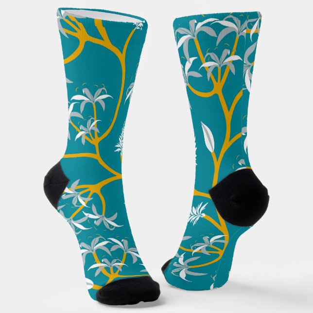 Teal socks with a bold yellow vine pattern  (Angled)