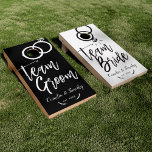 Team Bride | Team Groom Wedding Rings Cornhole Set<br><div class="desc">A unique black and white wedding themed cornhole set tailored to the newlyweds. It features a black or white backdrop with script style text that says "team right" and "Team groom." Underneath this are your wedding day details. All elements are unlocked and customizable by using the customization function. Enjoy being...</div>