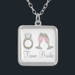 Team Bride Wedding Champagne Bridesmaid Necklace<br><div class="desc">Necklace features an original marker illustration of a glass of bubbly pink champagne and a diamond wedding ring,  with TEAM BRIDE in a fun font. A great bridesmaid / bridal party gift!</div>