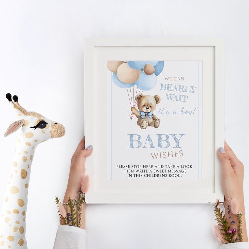 Teddy bear holding blue balloons baby shower sign