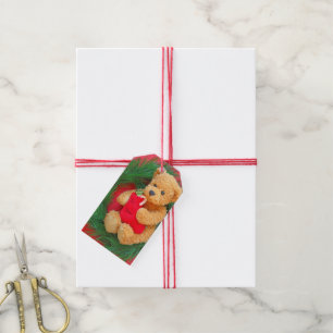 Teddy bear on wreath with stocking gift tags