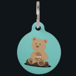 Teddy Bear Personalized White Text Pet ID Tag<br><div class="desc">A cute Teddy Bear sitting on a log,  has your pet's name on its belly. On the back,  personalize with your contact details. Add your pet's name and your contact information by following the "Personalize this template" link.</div>