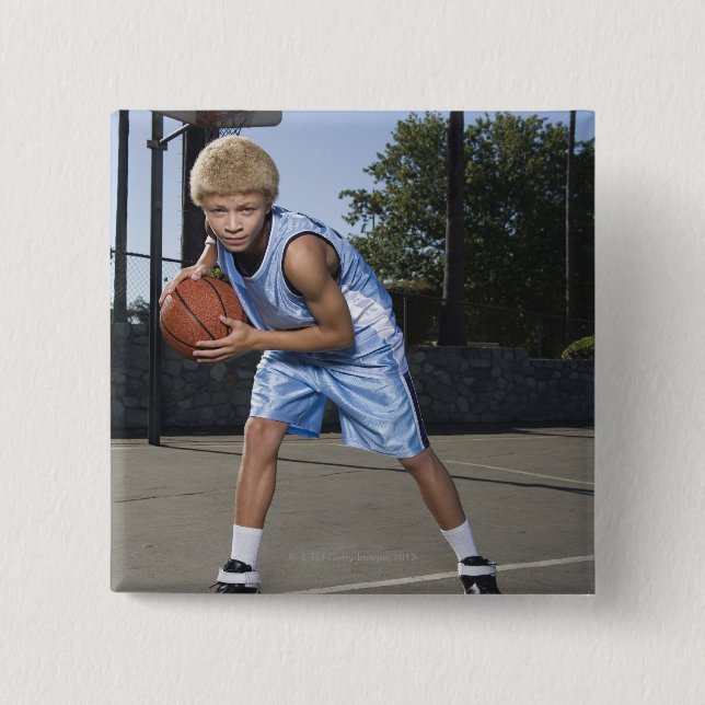 Teenage boy on basketball court 2 pinback button (Front)