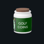 TEES AND COINS CANDY JAR<br><div class="desc">Just the right place to keep those golf tees that you leave in your pocket or those ball markers that get mixed up with your pocket change. Keep your desk neat and put those loose items in this cool candy jar. Art image is a golfer teeing off.</div>