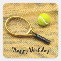 Tennis ball and racket on brown Birthday Sticker