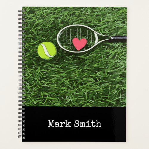 Tennis ball and racket on green with name planner