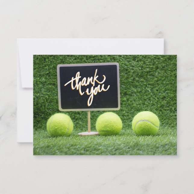 Tennis ball is on green grass with chalkboard thank you card (Front)