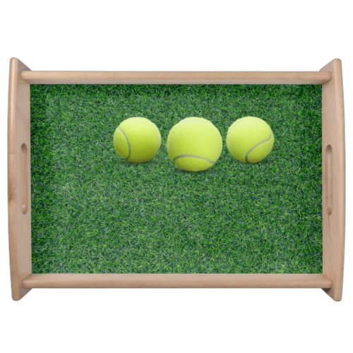 Tennis ball  on green   serving tray