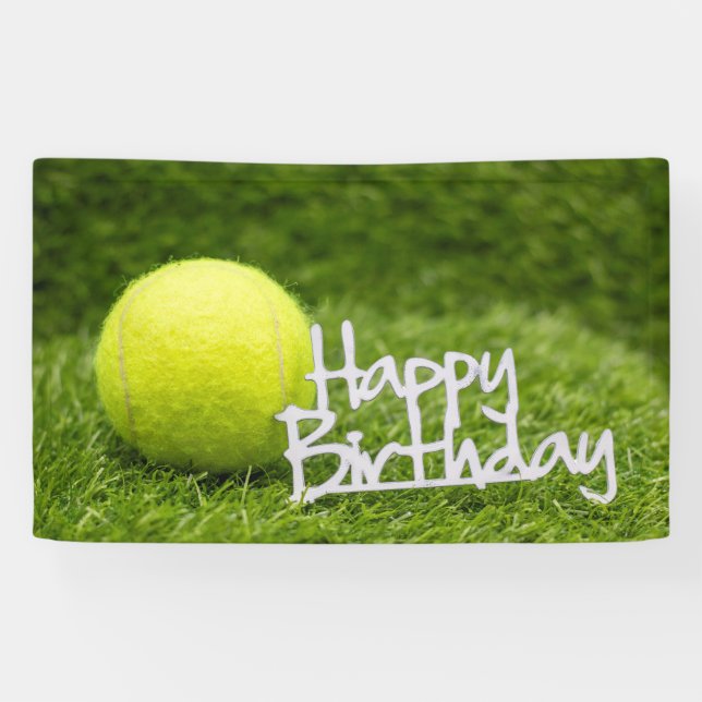 Tennis ball with happy birthday word on green banner (Horizontal)