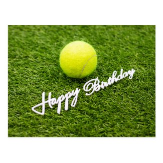 Tennis ball with happy birthday word on green postcard