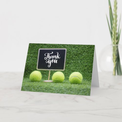 Tennis ball with word thank you on chalk board  ca card