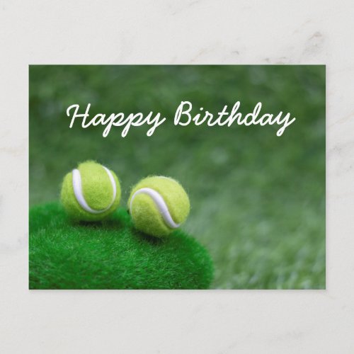 Tennis balls are on green grass birthday card