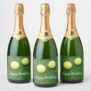 Tennis balls on green grass sparkling wine label