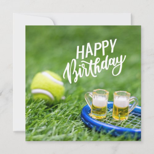 Tennis Birthday with ball and beer on green grass 