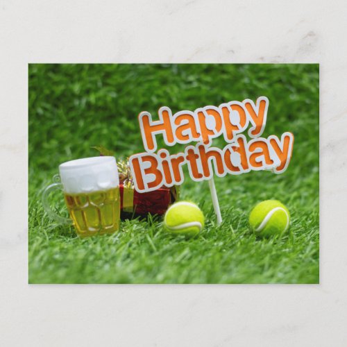 Tennis birthday with ball and gifts on green grass postcard