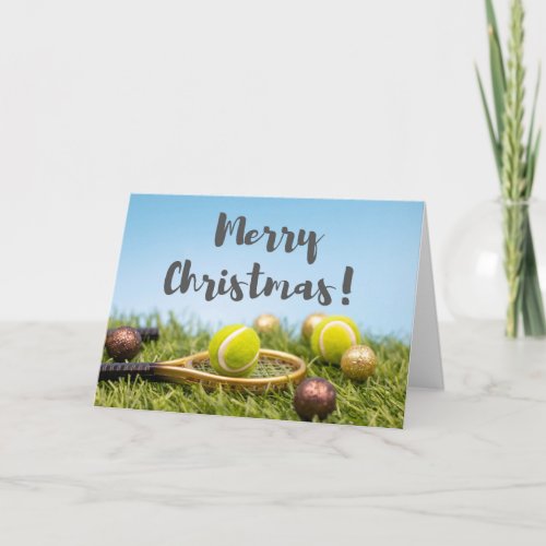 Tennis Christmas with racket and ball on green Card