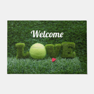 Tennis is on green grass with love welcome doormat