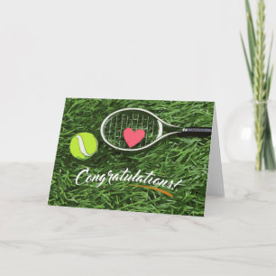 Tennis racket and ball with love congratulations card