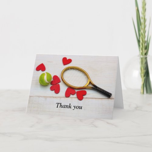 Tennis racket and ball with love red heart thank you card