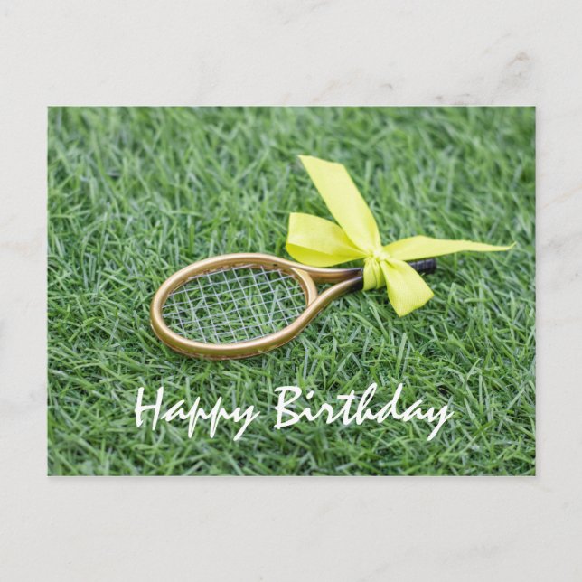 Tennis racket and tennis balls are on green grass postcard (Front)