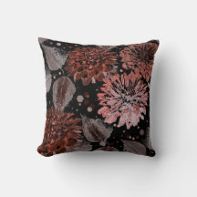 Terracotta flowers with gray leaves on a black