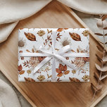 Terracotta Rust Boho Floral Fall Foliage Wrapping Paper<br><div class="desc">Wrap your gifts in delightful autumn charm with this custom wrapping paper, featuring a captivating botanical design. A soft white background highlights a beautiful medley of warm terracotta leaves, delicate cream blooms, and subtle brown accents, creating an elegant pattern. This enchanting artwork adds a touch of seasonal beauty, making every...</div>